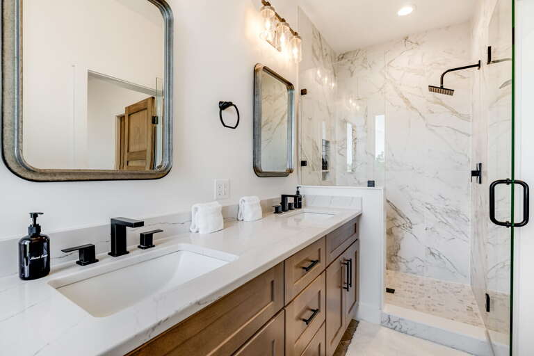 Main Suite/Bedroom Two - Attached Shower Bath w/ Dual Vanities