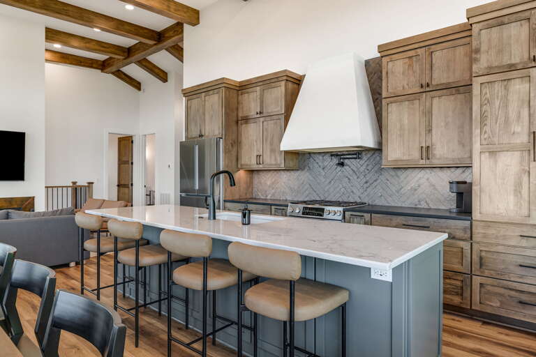 Gourmet Chef's Kitchen w/ Breakfast Bar Seating & Stainless Steel Appliances