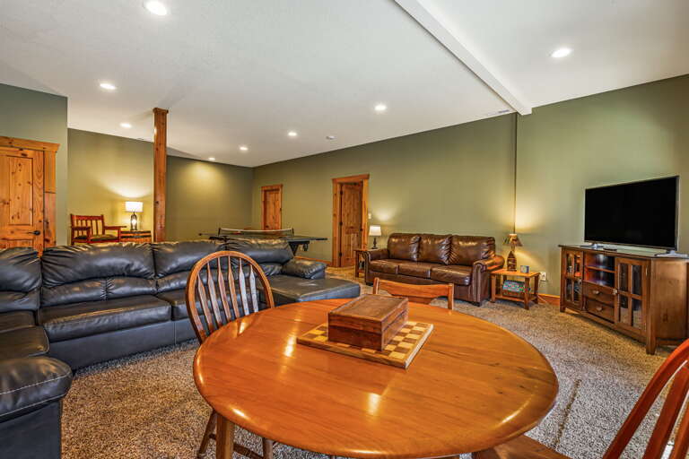 Lower Level - Living Area w/ Smart TV, Card Table, and Ping Pong
