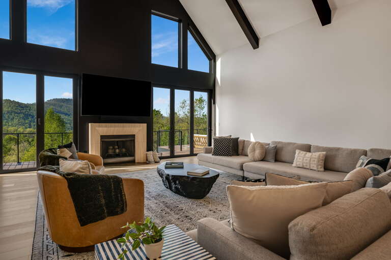 Main Level - Living Area w/ Smart TV & Decorative Fireplace