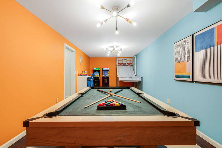 Challenge friends to pool while arcade games await your turn in this vibrant entertainment space.