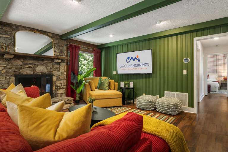 Main Level - Living Area w/ Wood Fireplace & Smart TV