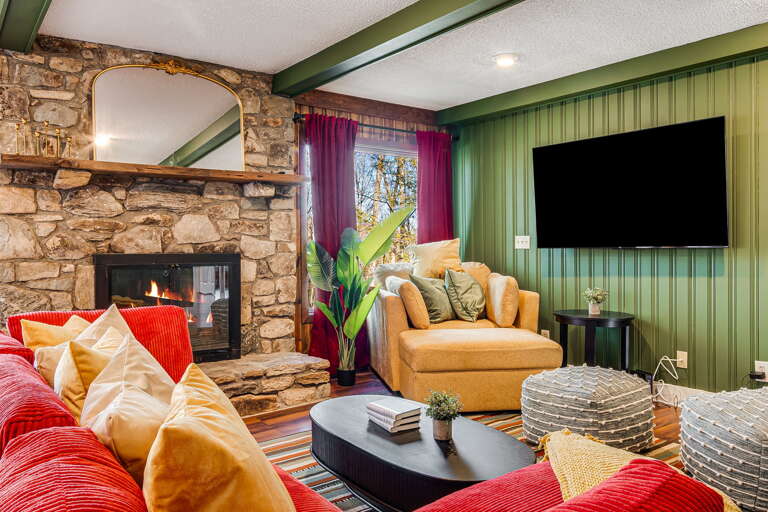 Living Area w/ Wood Fireplace and Smart TV