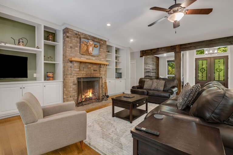 Living Area w/ Wood Fireplace and Smart TV