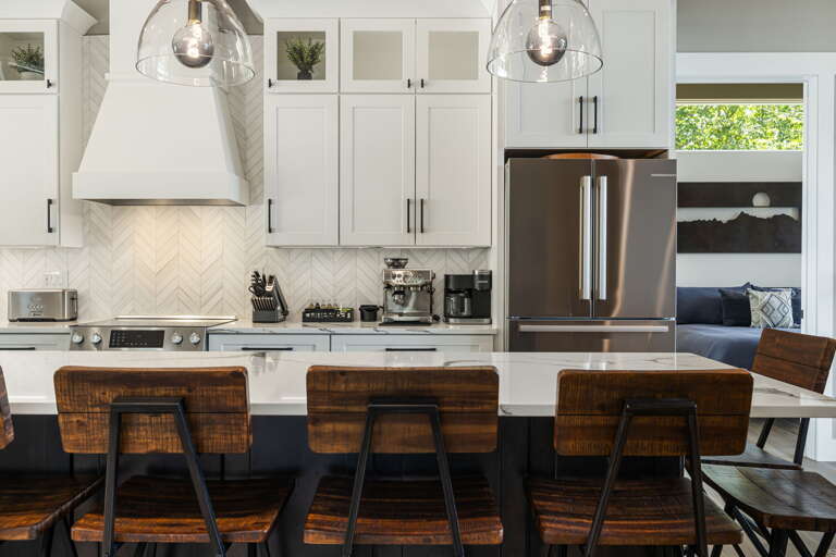 Main Level - Chef's Kitchen w/ Stainless Steel Appliances & Breakfast Bar Seating