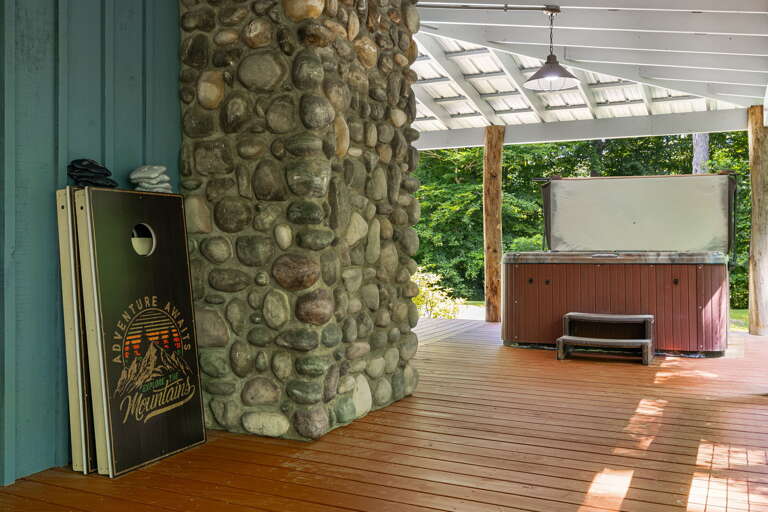 Cornhole and Covered Hot Tub