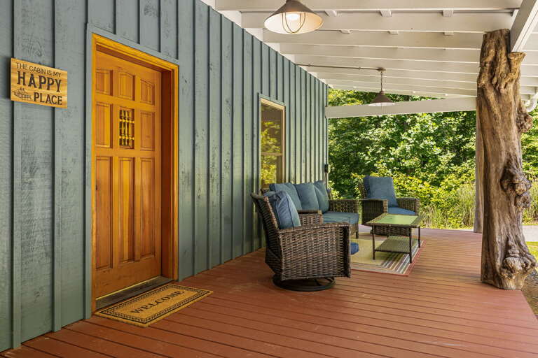 Covered Front Porch w/ Outdoor Seating and Main Entry