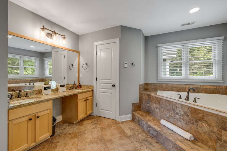 Main Suite/Bedroom One -Attached Full Bath w/ Dual Vanities, Soaking Tub, & Walk-In Shower