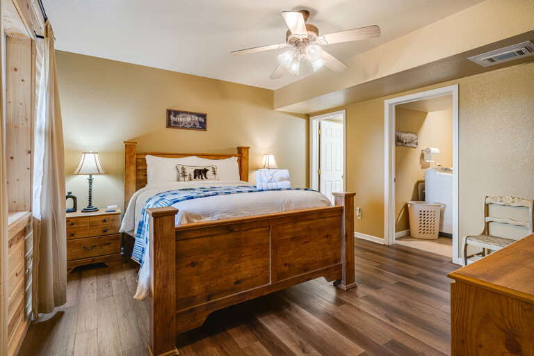 Main Suite/Bedroom Four - Queen Bed w/ Attached Full Bath & Laundry Area