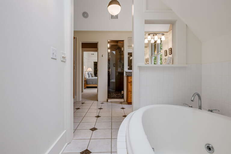 Main Suite/Bedroom One - Attached Full Bath w/ Jetted Soaking Tub & Walk-In Shower