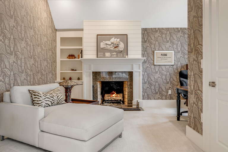 Main Suite/Bedroom One - Attached Sitting Area w/ Non-Functioning Aesthetic Fireplace & Dedicated Office Space