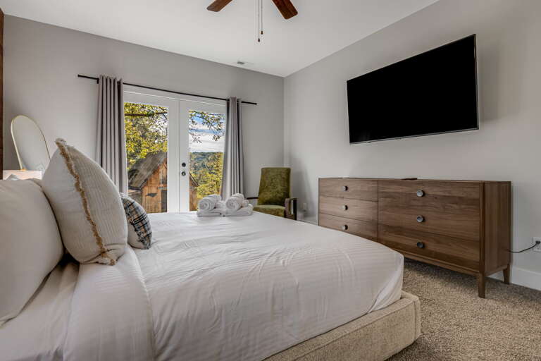 Main Suite/Bedroom One - King Bed w/ Smart TV and Backyard Access