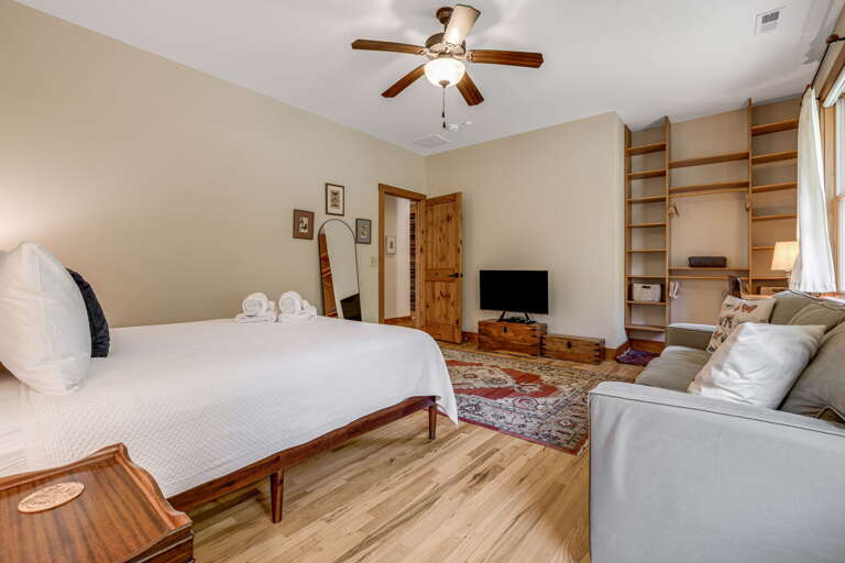 Main Level - Main Suite/Bedroom One - Queen Bed w/ Smart TV