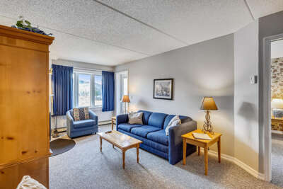Bright Blue Sofa And Armchairs, Sunny Space With Lamps And Tables