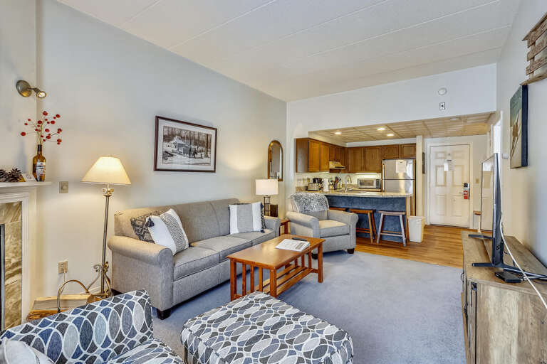 Living Room Leading To An Open Kitchen With A Breakfast Bar