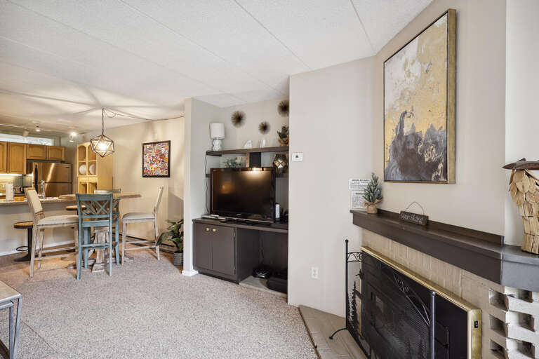 Living Room With Fireplace, Dining Area In Distance, Subtle Shades, Serene Setting