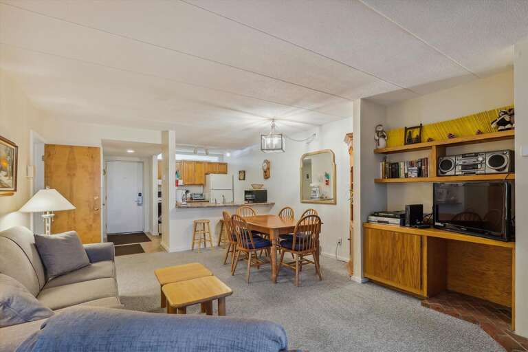 Spacious Living Space, Sleek Shelves, Subtle Lighting