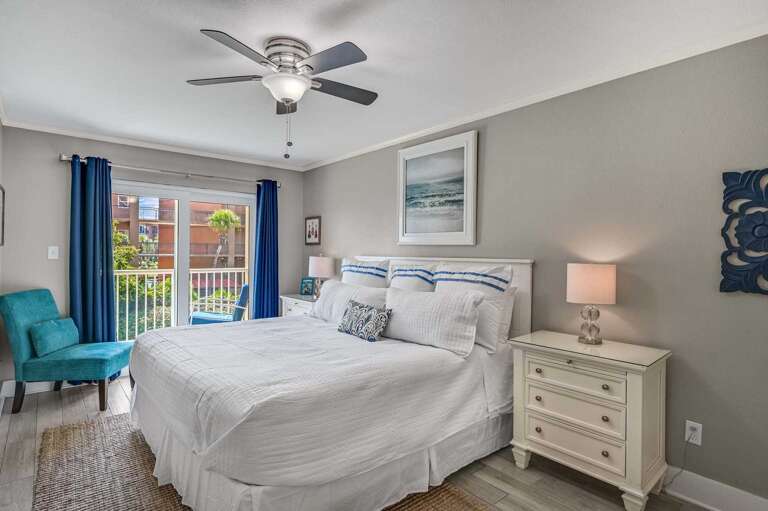 Bright and Breezy King Bedroom - Unpack and
unwind in this spacious retreat with light tones,
blackout curtains, and direct balcony access.