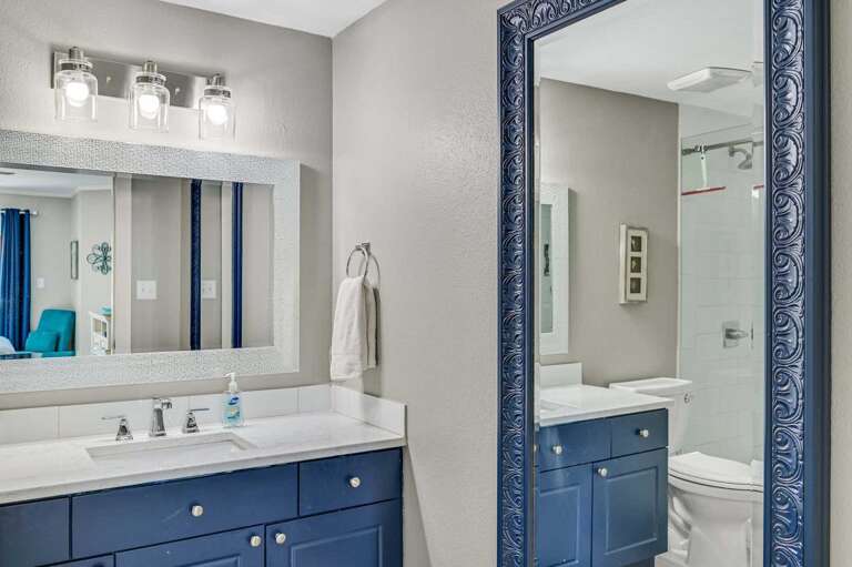 Private Ensuite Convenience - The primary bath
features sleek finishes, a spacious vanity, and walkin
shower with glass doors