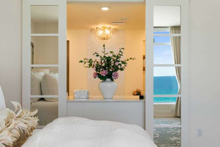 Privacy Screen Doors to the Primary Bath Allows for Views when you want them