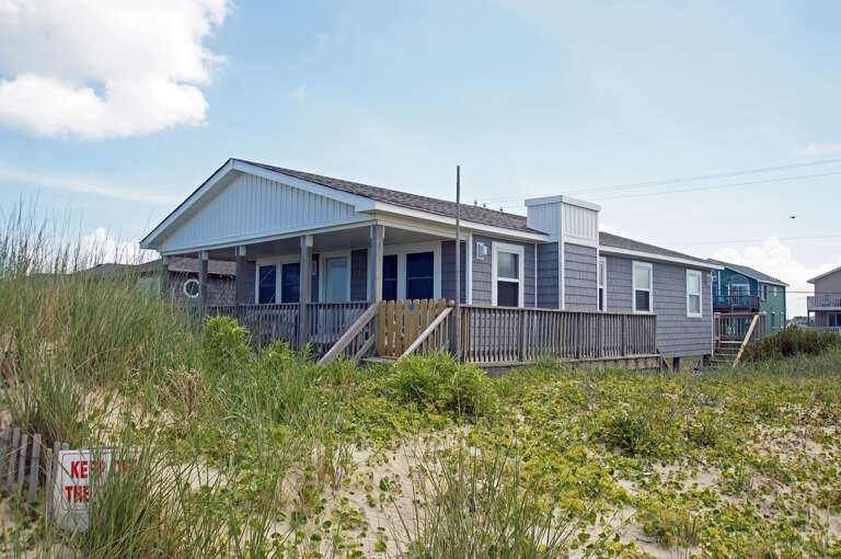 Beachfront Vacation Rental With Surrounding Grass