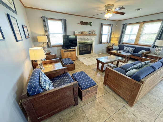 Living Room With Sofas, Coffee Table, And Fireplace