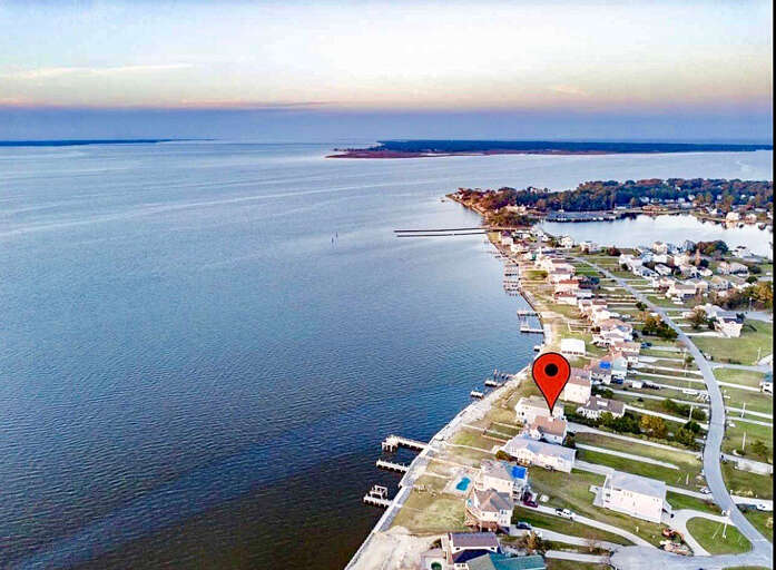 Aerial View Of Coastal Town With Location Marker