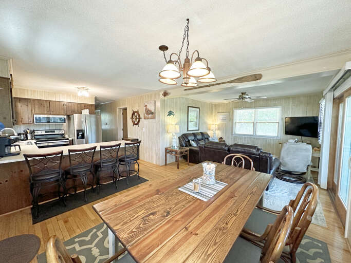 Interior Of A Vacation Rental Living Space With Kitchen And Dining Area