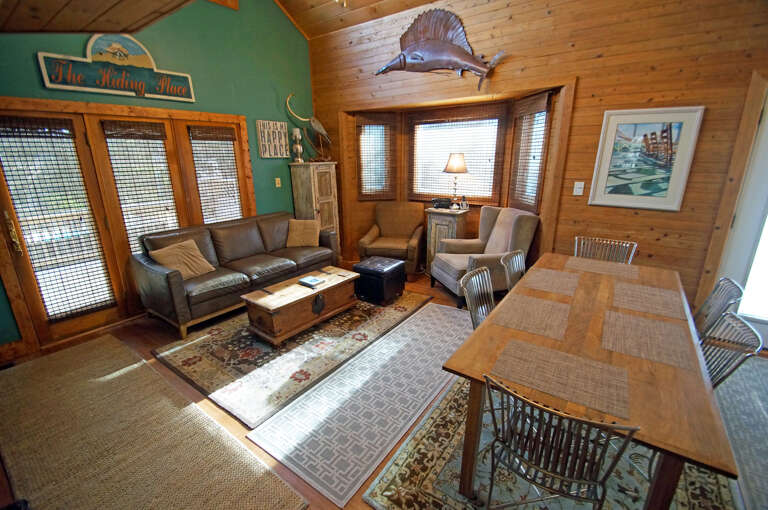 Wooden Interior Living Space With Furniture And Fish Wall Decor