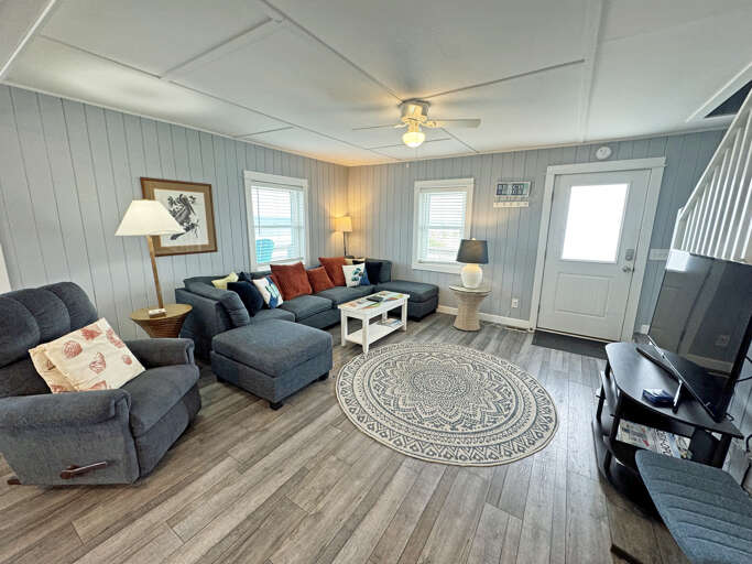 Living Room Interior Of A Vacation Rental With Sofas And TV Living Room Interior Of A Vacation Rental With Sofas And TV