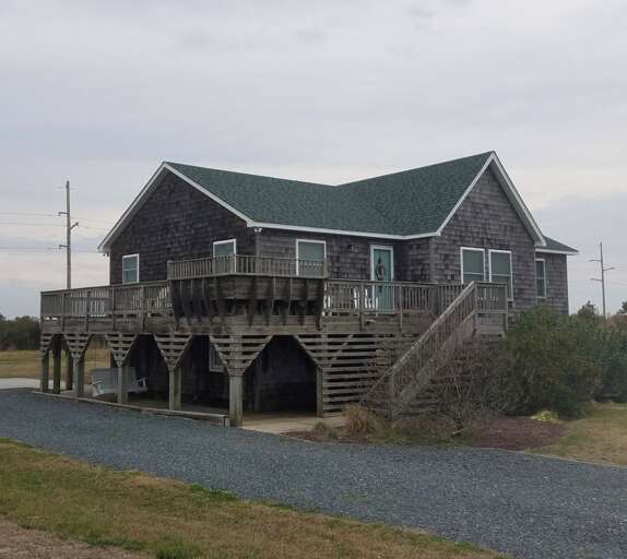 Elevated House With Deck And Stilts