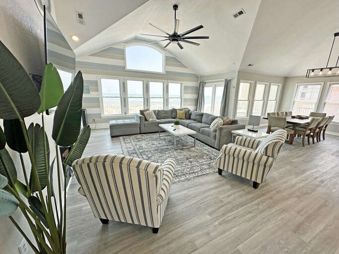 Spacious Living Room In A Vacation Rental With Sofas And Dining Area