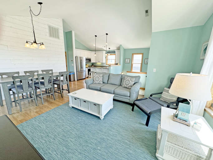 Living Room With Kitchenette And Dining Area In Light Colors
