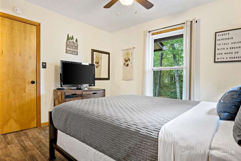 There is a TV in the 1st bedroom