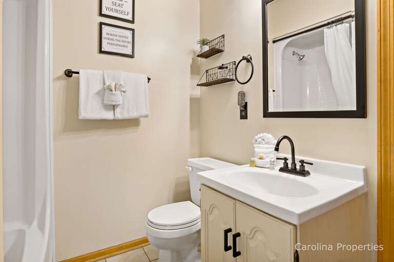 The second full bathroom has a shower and tub combo