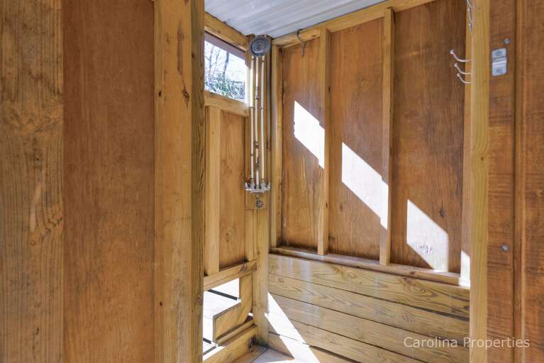Outside shower under the covered lakeside deck