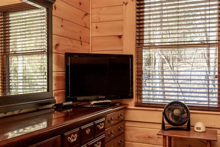 TV and plenty of storage in this bedroom.