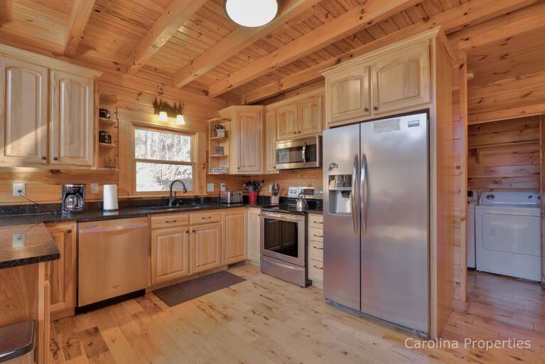 Walk past the kitchen to get to the washer and dryer