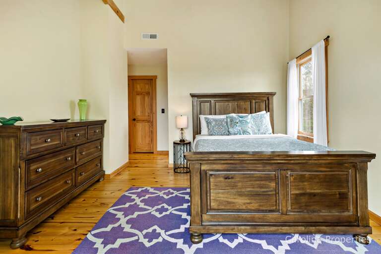 Upper level bedroom with a queen bed