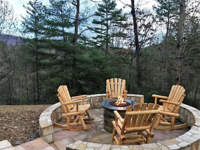 Rocking chairs by the fire pit on a beautiful winter day