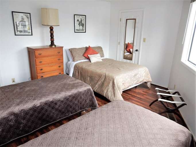 Additional view of bedroom with twins and full bed