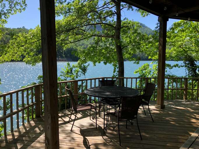 Lower level covered porch overlooking the lake Lower level covered porch overlooking the lake