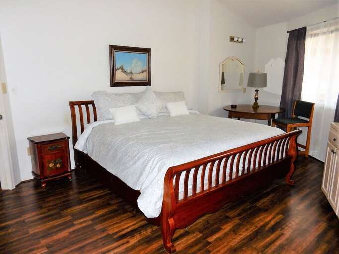 Upper level master bedroom with king bed and private bath