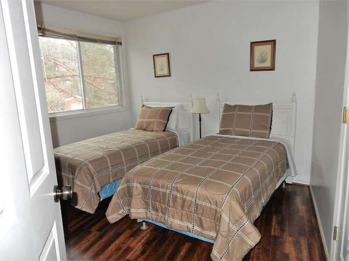 Lower level bedroom with two twin beds