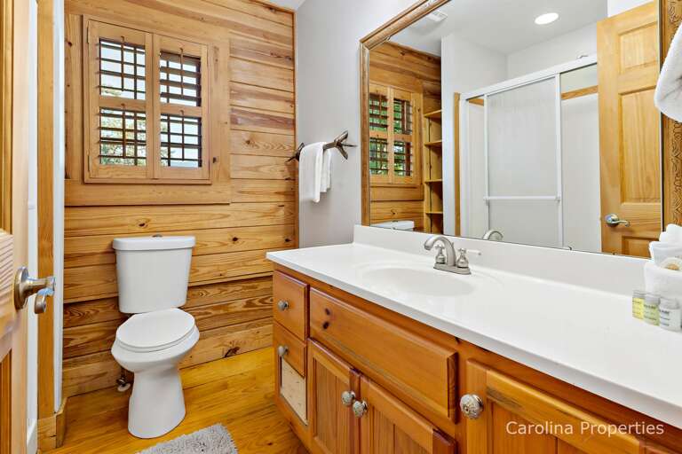 Upstairs bathroom with combination shower/bathtub