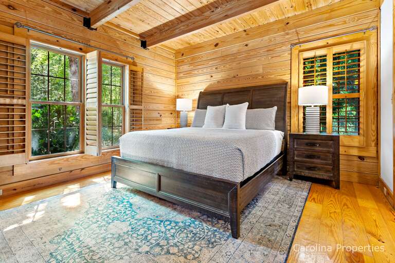 Lamps and side tables on both sides of the bed