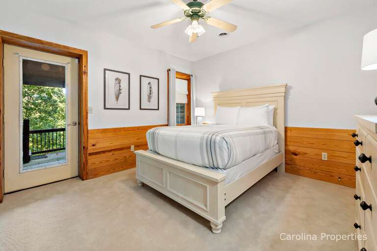 Lower level bedroom with queen bed