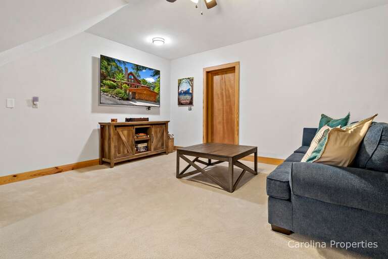 Large TV in the lower seating area