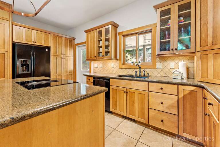 The U-shaped kitchen is fully equipped with all of the conveniences of home