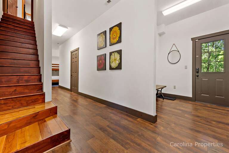 Head downstairs where you will find a room with bunk beds and a half bathroom